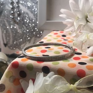 Silver and diamond likes stones clasp bracelet.